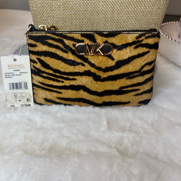 Michael Kors Handbags - NWT Michae Kors Animal Print Wristlet